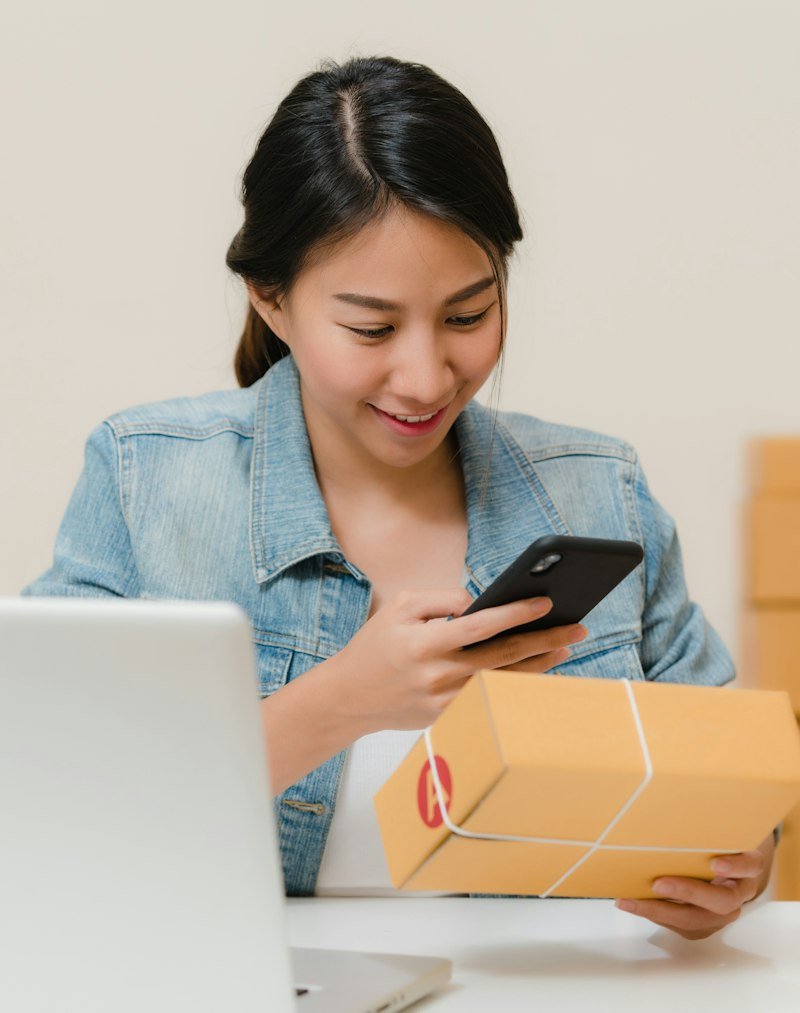Creator checking an order on her phone